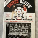 A football programme featuring a postponed match