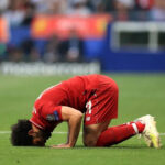 Mohamed Salah celebrating a goal with sujood, a sign of gratitude in Islam