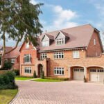 Mansions like this house in Cobham are popular with Chelsea players