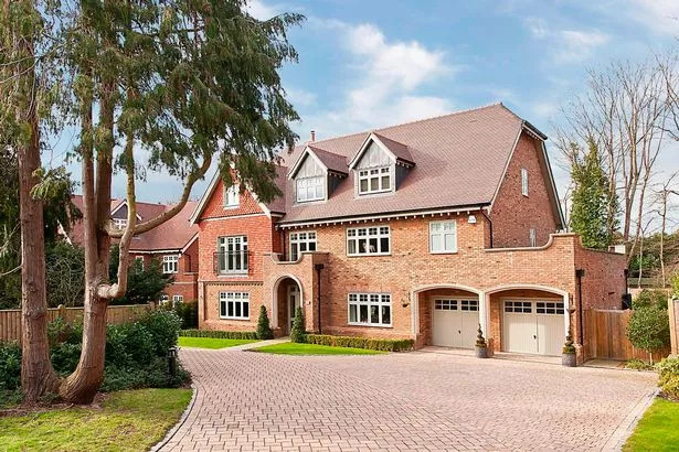Mansions like this house in Cobham are popular with Chelsea players