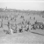 An impromptu game of football kicks off between British and Italian troops, as others take some time out to rest on the hills and watch on in 1917. Photo courtesy of Imperial War Museum