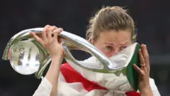 England's Ellen White kisses the Euro 2022 championship trophy