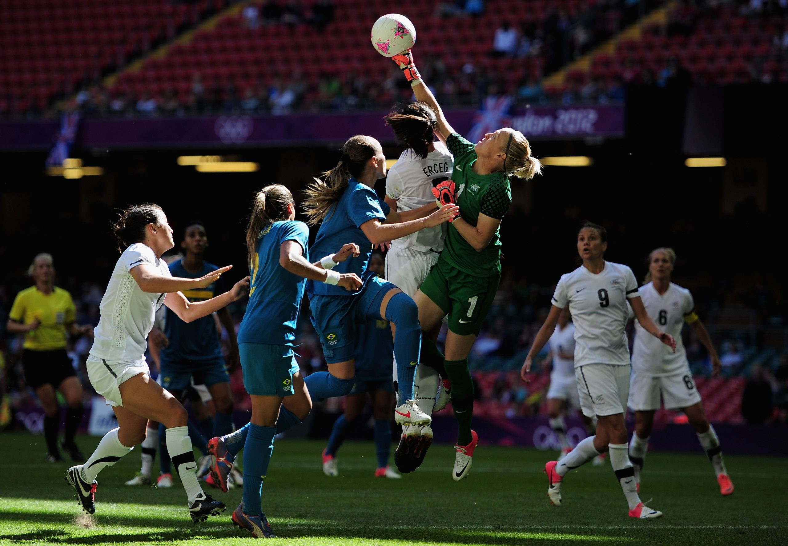 Jenny Bindon of New Zealand punches the ball clear during a Group E match against Brazil at the 2012 Olympic Games, highlighting the team's competitive spirit