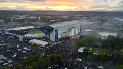 Thousands of fans outside Leeds United celebrating their promotion back to the Premier League