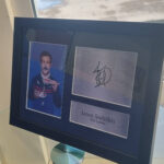 A framed copy of the show’s ‘BELIEVE’ motto and a signed photo of star Jason Sudeikis