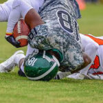 Football player being tackled