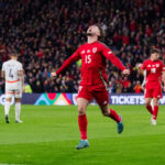 Liam Cullen celebrates scoring a goal for Wales as fans will be able to watch free coverage of the men