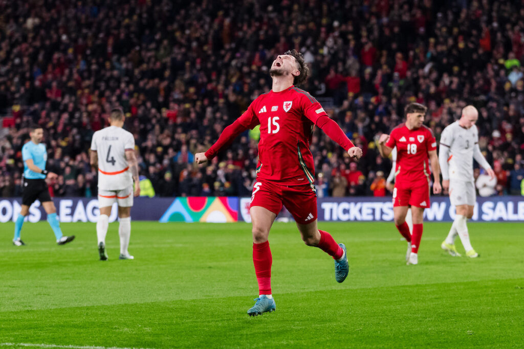 Liam Cullen celebrates scoring a goal for Wales as fans will be able to watch free coverage of the men