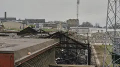 The fire-damaged skeleton of a football stand at Bradford City