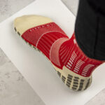 Foot in sock on clean paper