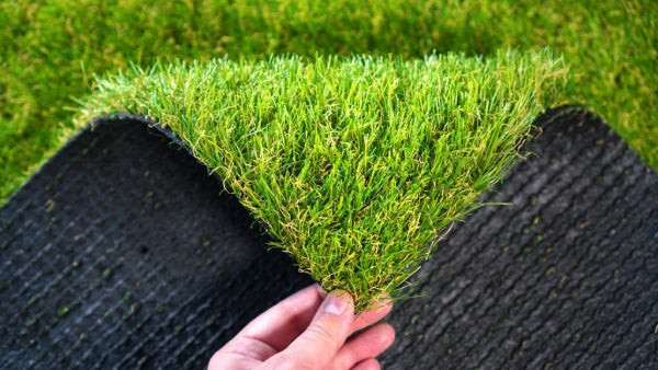 Artificial grass for football field construction in a garden setting