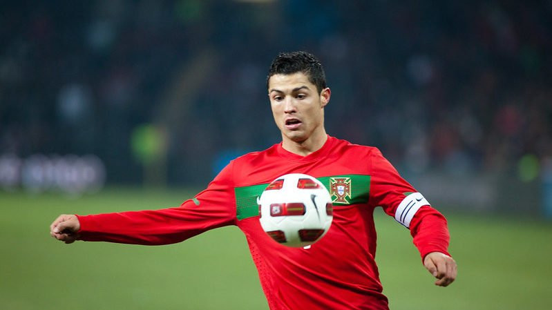 Cristiano Ronaldo playing for Portugal, benefiting from sponsorships.