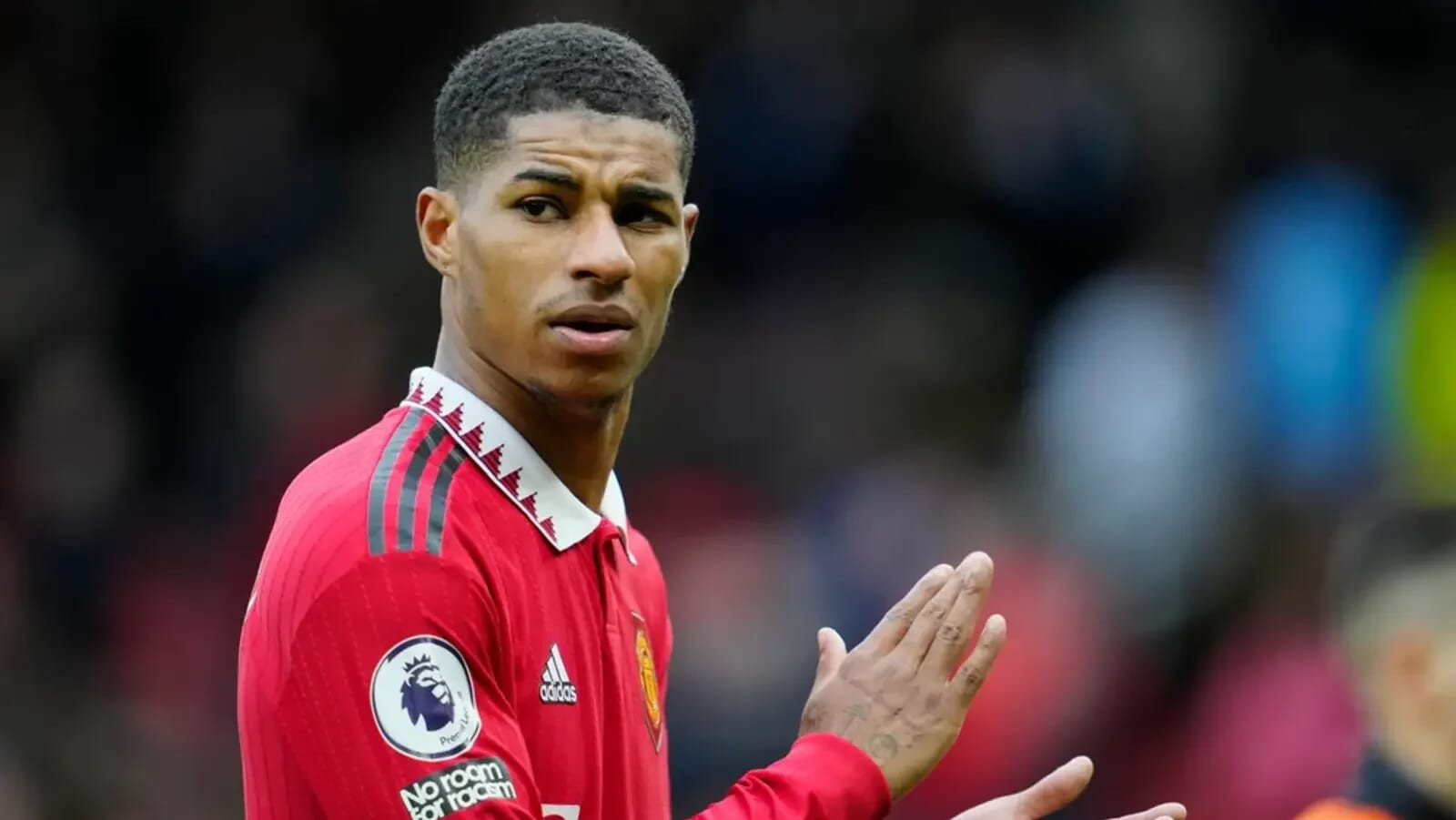 Marcus Rashford celebrating a goal for Manchester United, part of the highest paid Premier League players list.