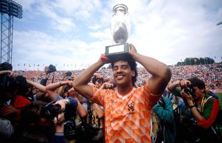 Frank Rijkaard celebrates with the trophy after winning Euro 88