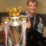 Roy Carroll celebrating a victory with Manchester United, showcasing his successful years at the club.