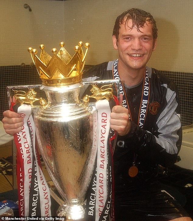 Roy Carroll celebrating a victory with Manchester United, showcasing his successful years at the club.