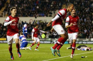Theo Walcott celebrates after scoring Arsenal’s sixth goal against Reading