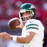 Aaron Rodgers in action for the New York Jets, symbolizing resilience and longevity