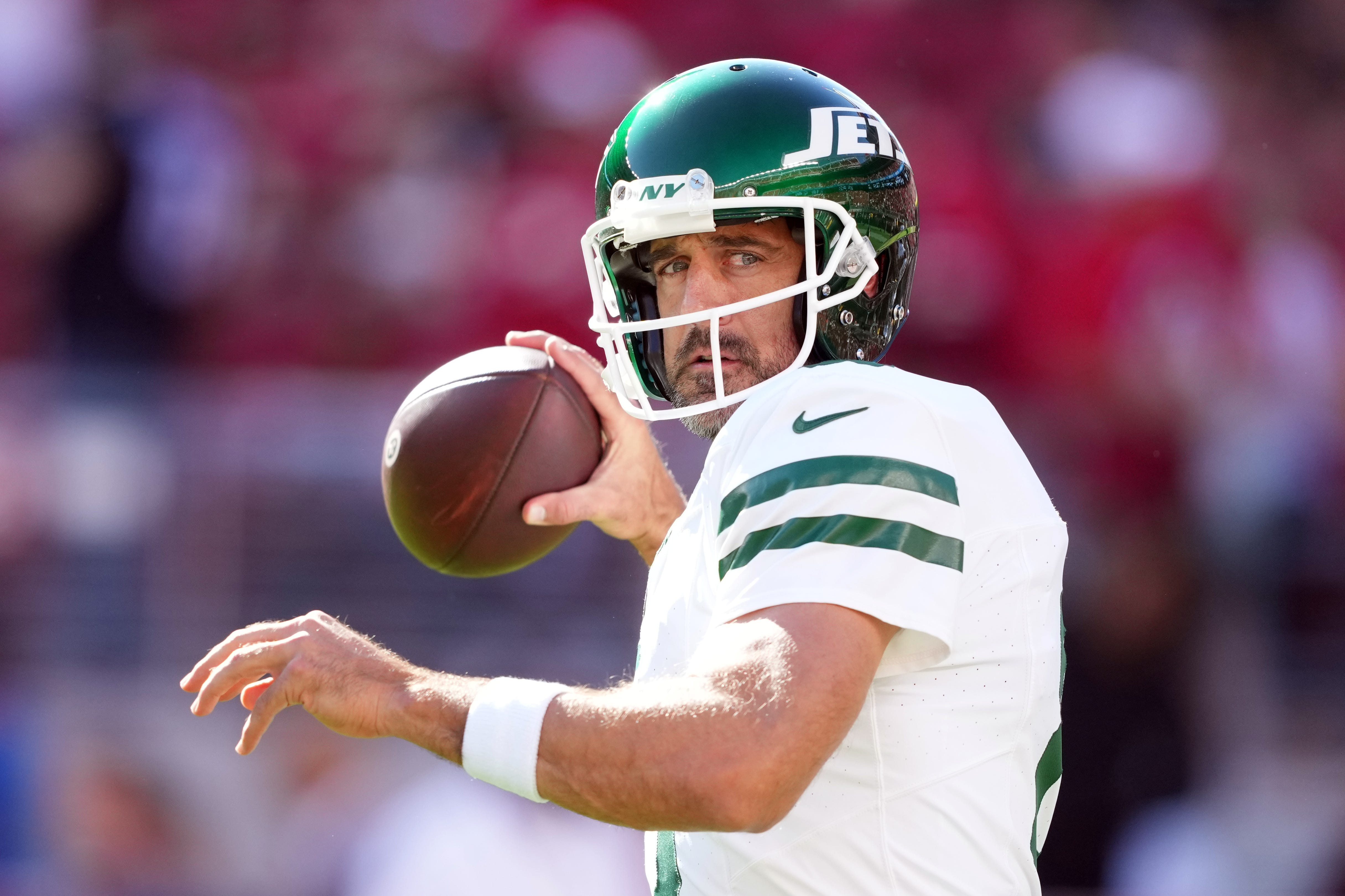 Aaron Rodgers in action for the New York Jets, symbolizing resilience and longevity