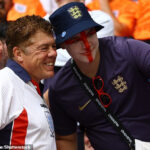 Andy Milne (L) has become known as an England superfan for regularly being seen at games