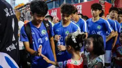 Players from local villages participate in the China Football League as farmers, shopkeepers and students