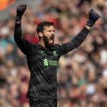 Alisson Becker celebrates a goal for Liverpool against Tottenham in May 2024.