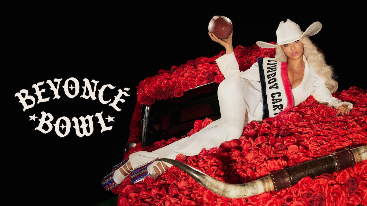Beyoncé sits on a car covered in roses holding a football.
