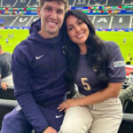 John Stones and Olivia Naylor inside a football stadium