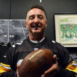 Jim Baker shows off the football used in the Immaculate Reception.