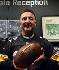 Jim Baker shows off the football used in the Immaculate Reception.