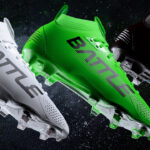 Three pairs of football cleats in white, green, and black on a dark background, perfect for improved traction.