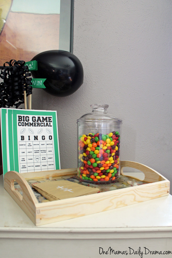 commercial bingo cards beside a big jar of Skittles