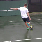 Soccer player kicking a ball