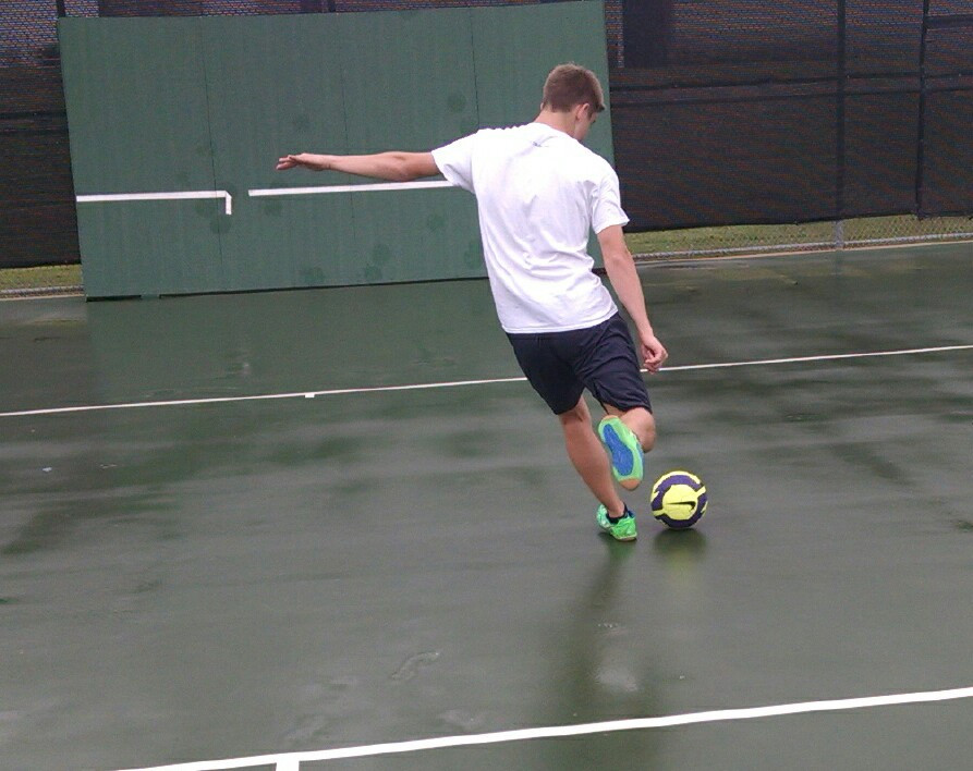 Soccer player kicking a ball