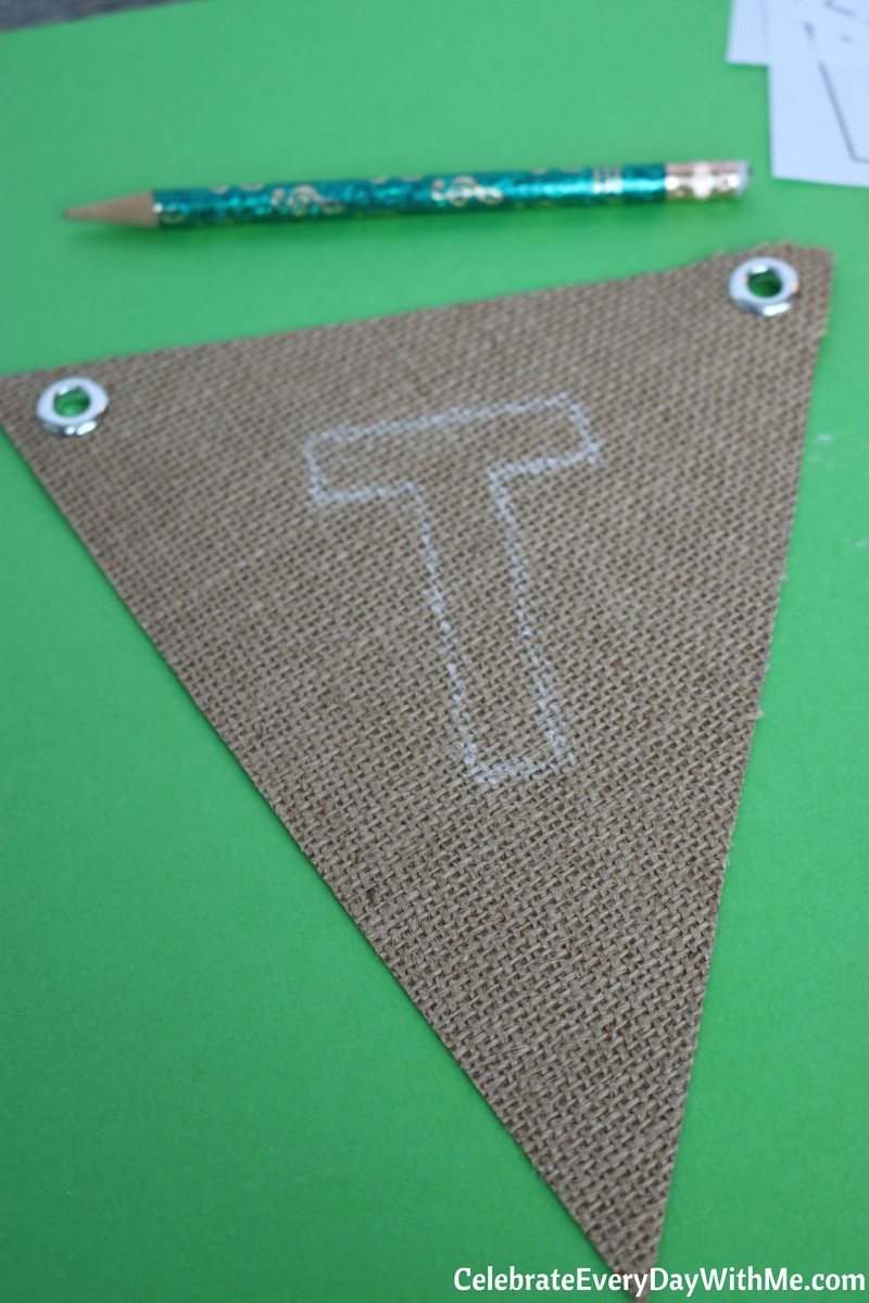 Painting letters onto football banner