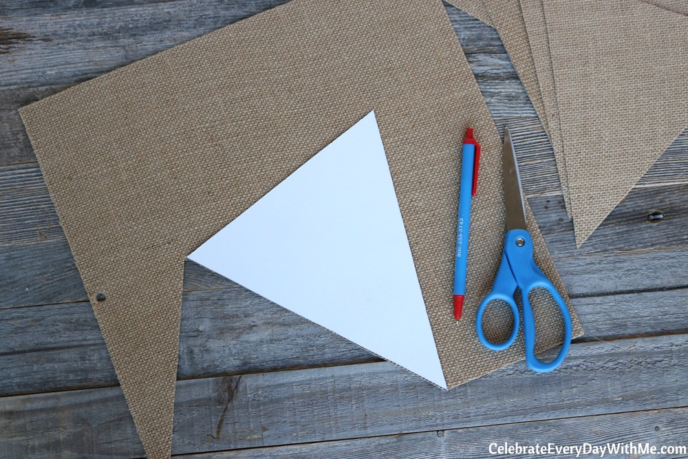 Tracing banner template on burlap fabric
