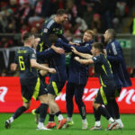 Andy Robertson marked his 80th cap with a sensational stoppage-time winner in Poland to retain Scotland’s hopes of staying in the top level of the UEFA Nations League
