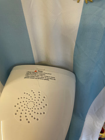 Carefully use the steamer by the shirt