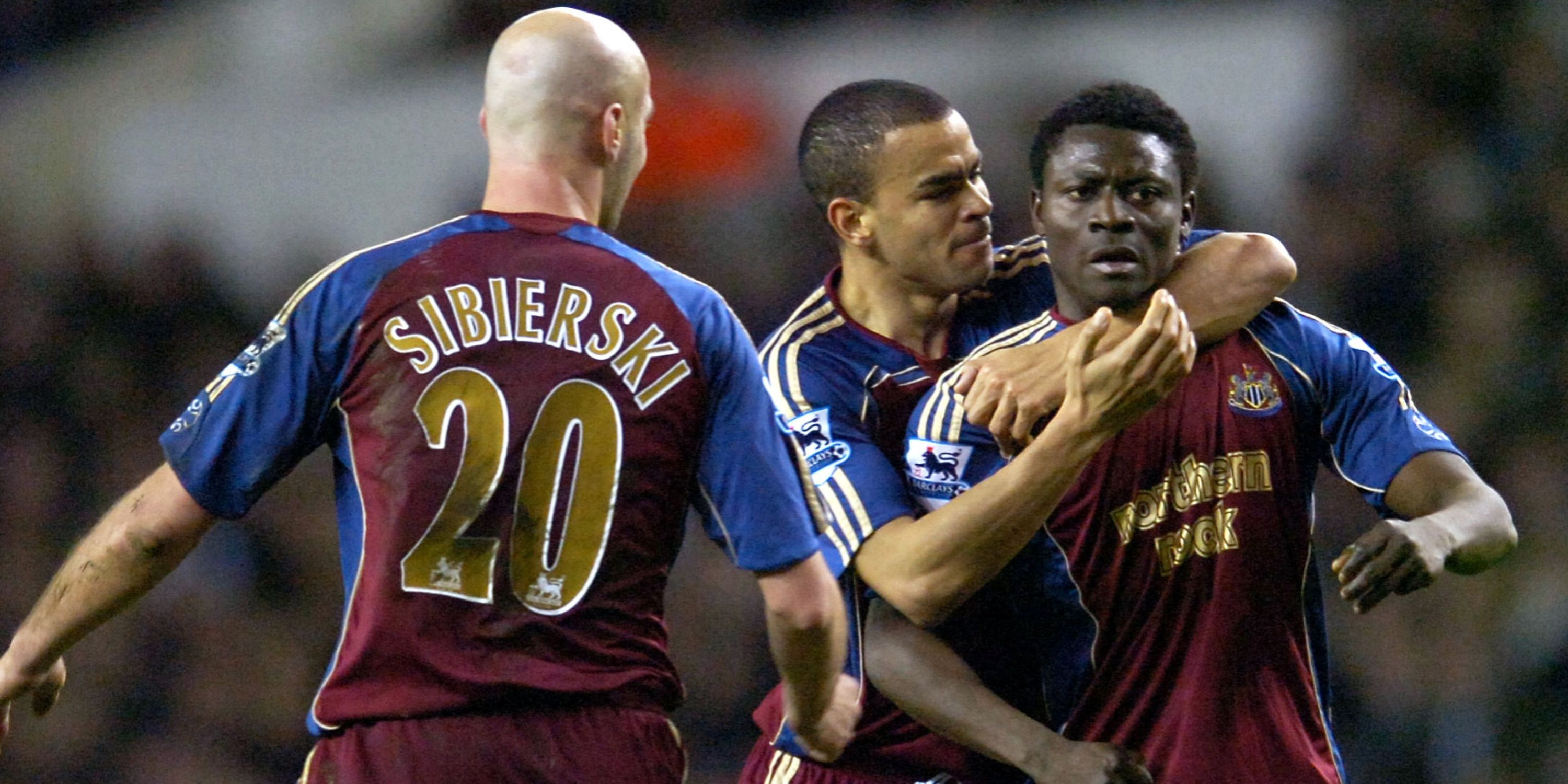 Obafemi Martins celebrates scoring the second Newcastle United goal with teammates Kieron Dyer and Antoine Sibierski