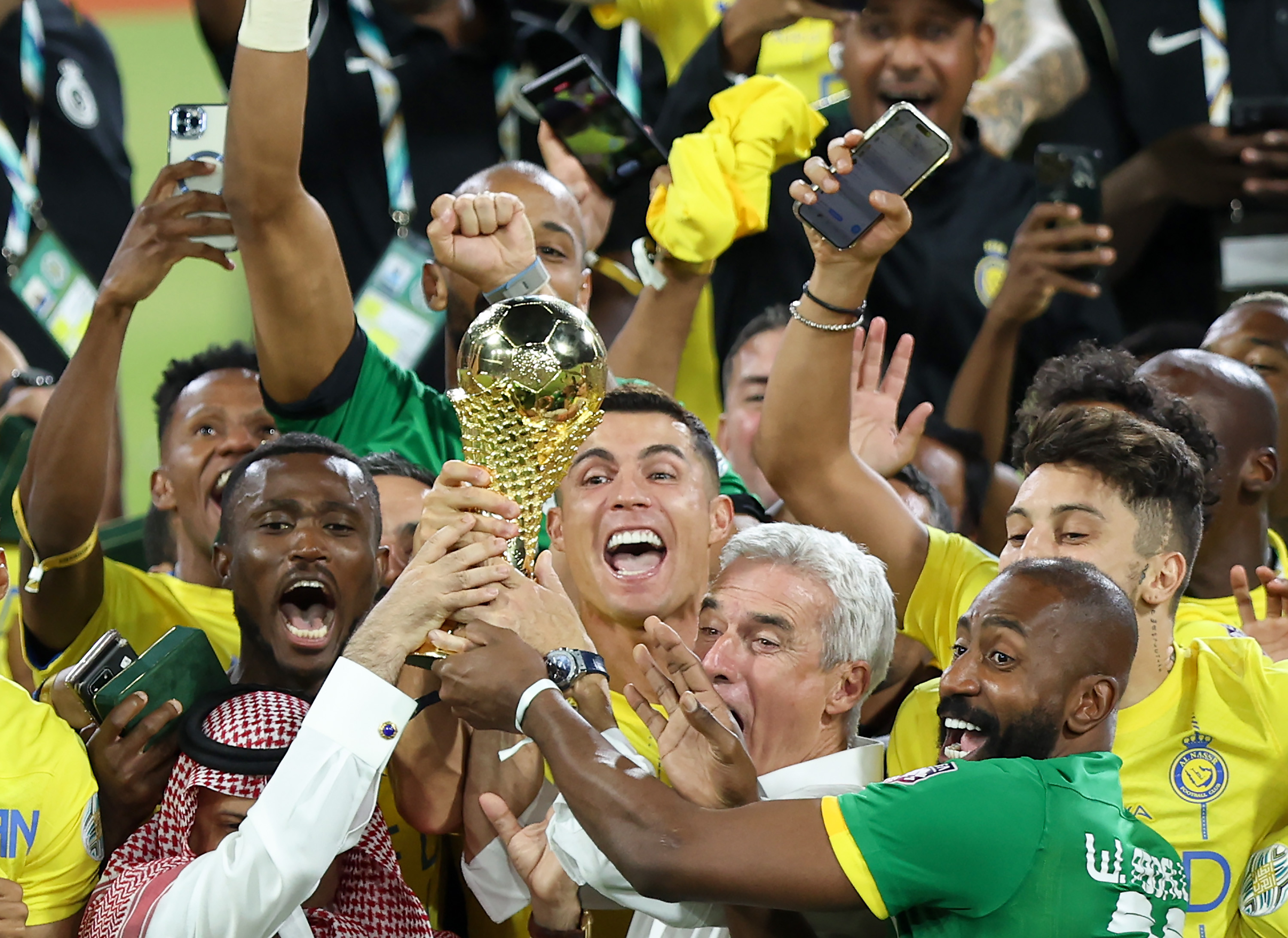 Cristiano Ronaldo lifting a trophy with Al Nassr