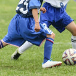 Footballer controls the ball with foot