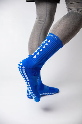A football player benefiting from the increased grip and stability provided by grip socks