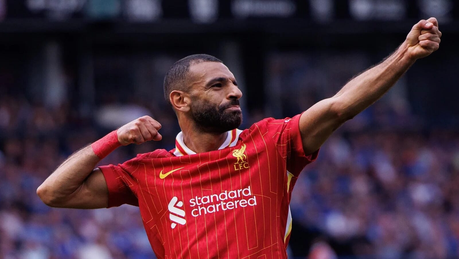 Mohamed Salah playing for Liverpool, emphasizing his global appeal and significant endorsement deals as one of the highest paid footballers.