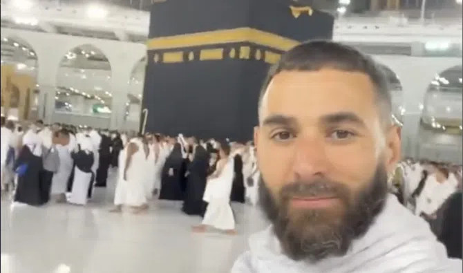 Karim Benzema in Al-Ittihad jersey, celebrating a goal