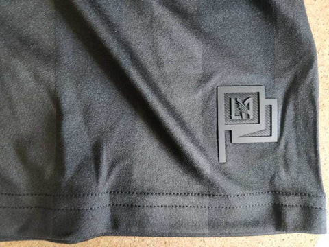 Example of a replica LAFC shirt with an application detail on the bottom right and a material type tag on the left