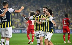 Fenerbahce Football Club donning their home kit featuring yellow and navy blue stripes