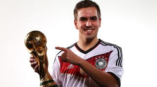 Philipp Lahm poses with the FIFA World Cup Trophy in Zurich, Switzerland A footballing mastermind
