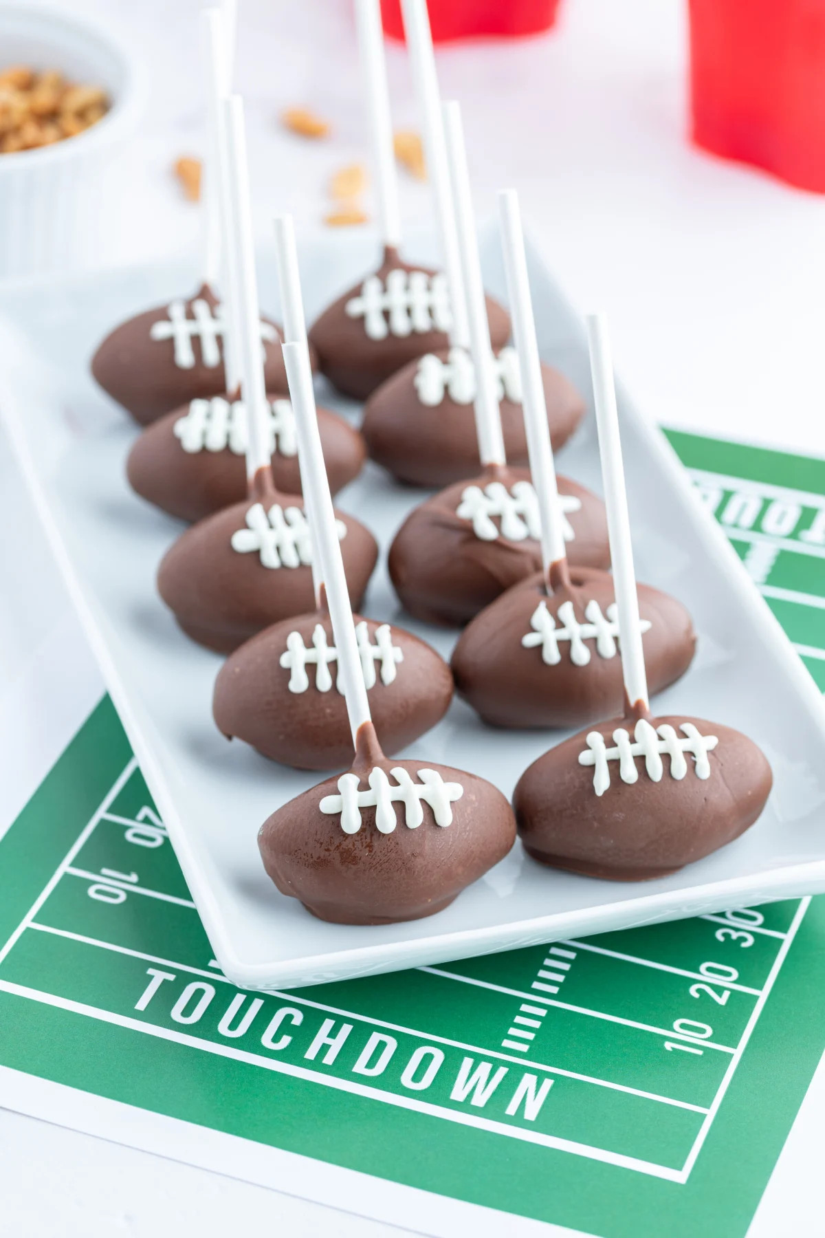 Football cake pops on platter