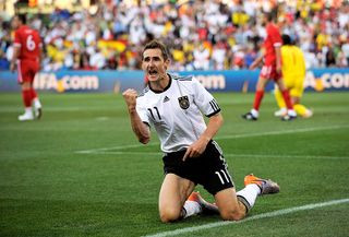 The best German players ever Miroslav Klose scoring during the 2010 FIFA World Cup match between Germany and England
