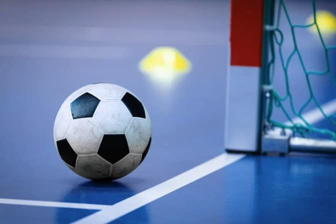 Futsal is played on a hard court